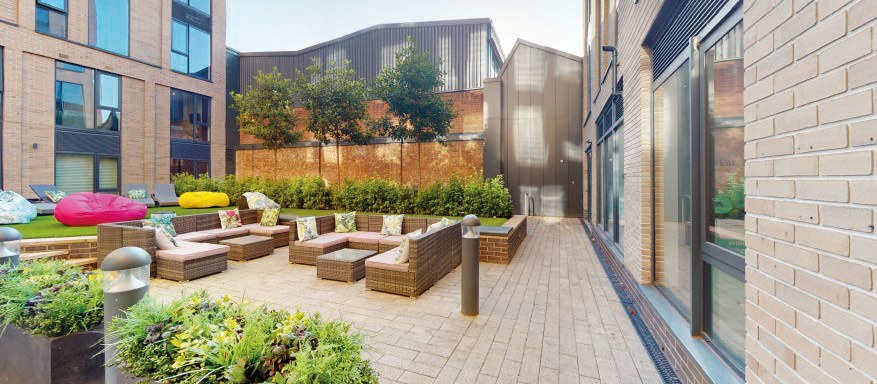 Landscaped internal courtyard with lounge seating