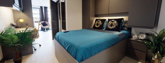 Studio bedroom with study desk and kitchenette