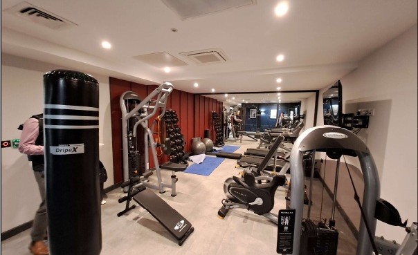 Residents' fitness suite with cardio and weights equipment
